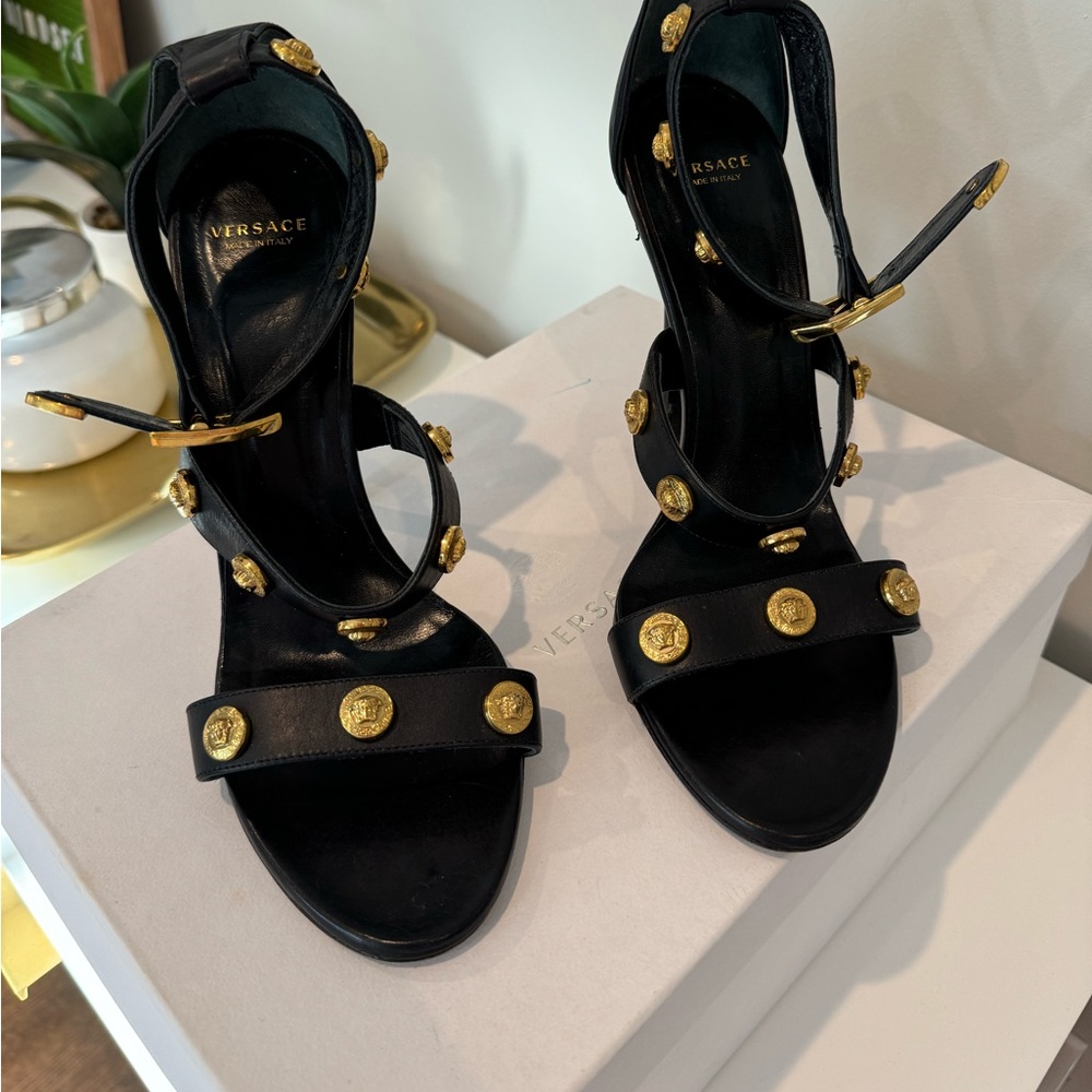 Versace sandals in excellent condition with original box.